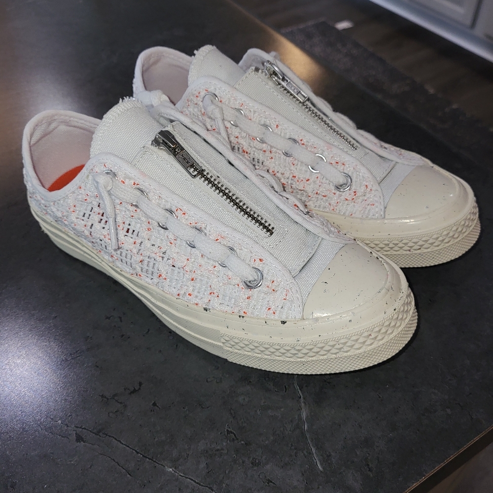 Converse tennis shoes. White with different colored specks zip closure
